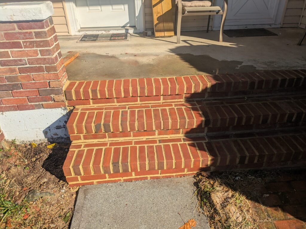 Before and after brick front steps repair in York PA.