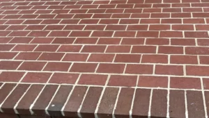 Brick patio and steps repointing after tuckpointing in York PA by LBE Masonry showing fresh white mortar joints