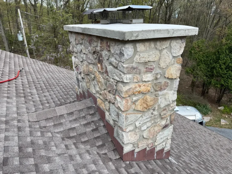 Stone chimney rebuild with new concrete crown York PA by LBE Masonry
